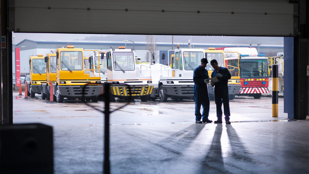 Maintenance Workers Reviewing Plans